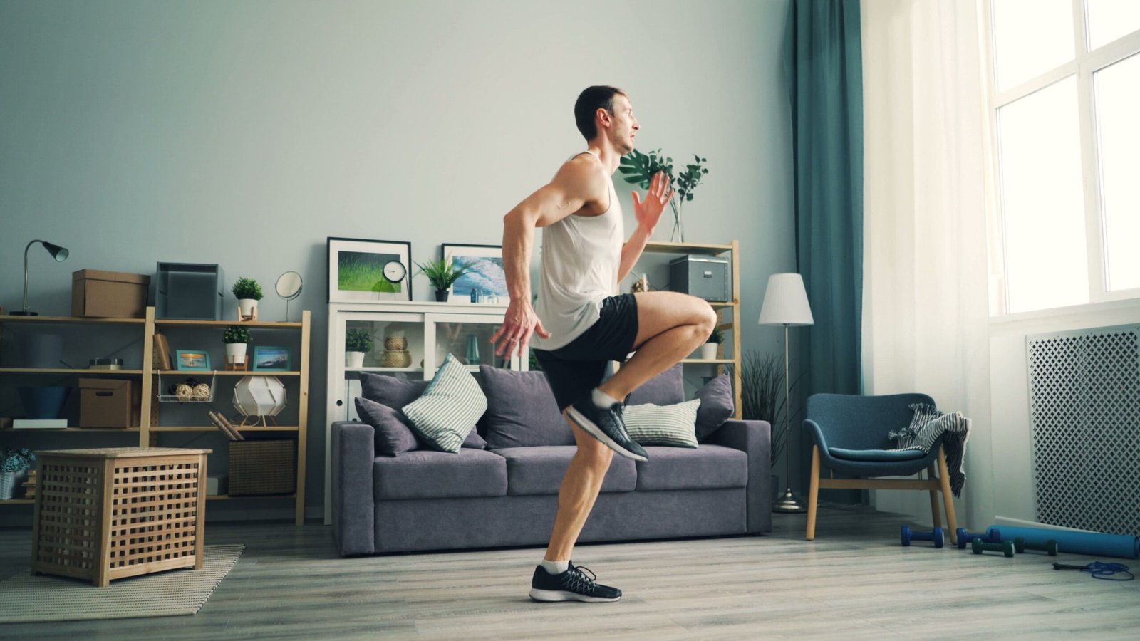 Exercise Snacks: 4 Proven Minutes for a Surprising Drop in Mortality Risk 1 man doing vigorous high-knee exercise snack in living room