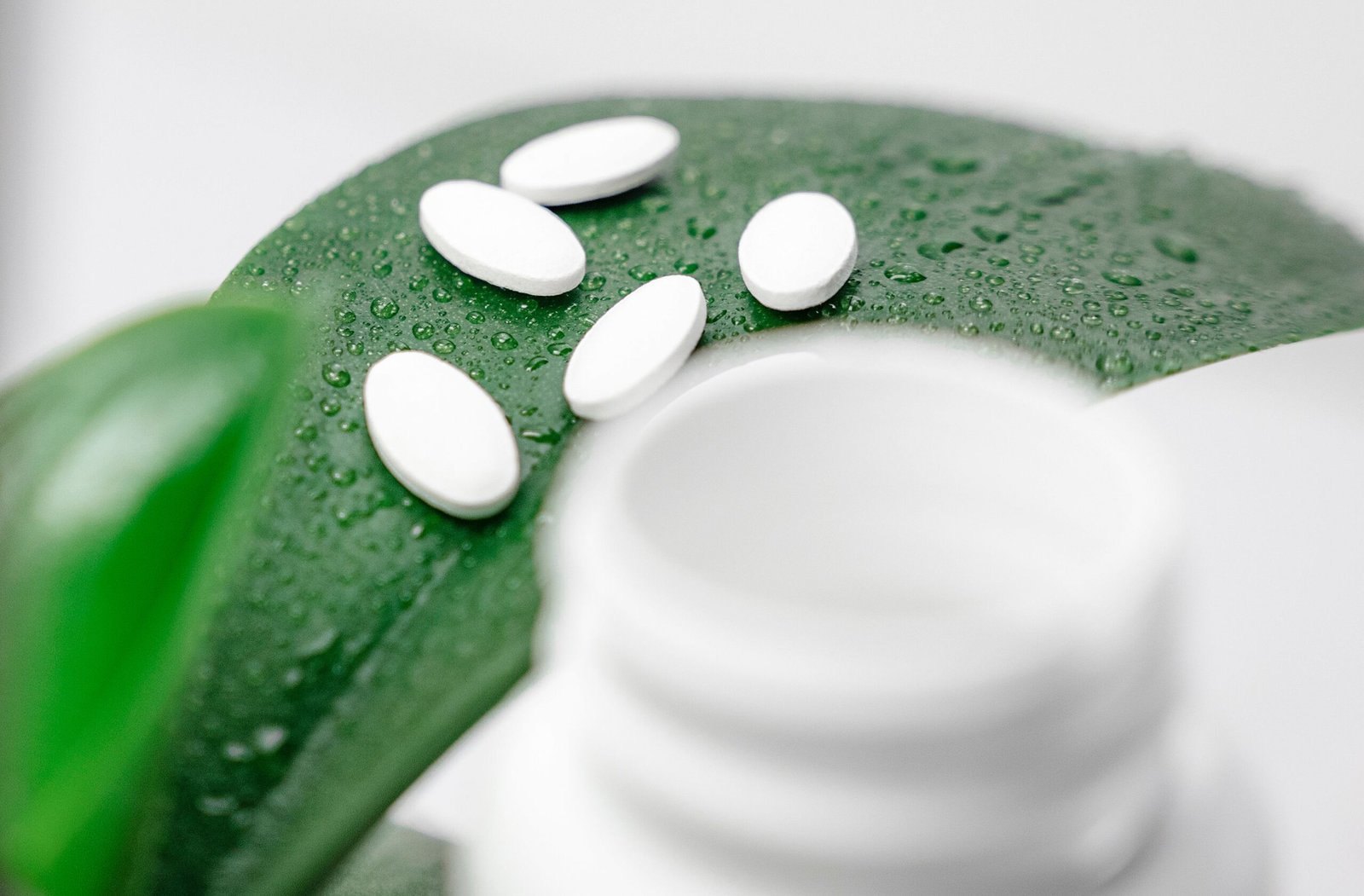 magnesium deficiency supplement tablets on leaf